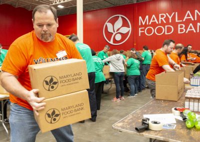 Pack To Give Back in Maryland Food Bank warehouse