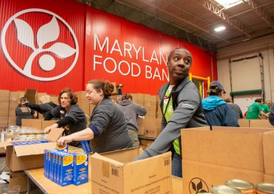 people packing boxes in Maryland Food Bank warehouse