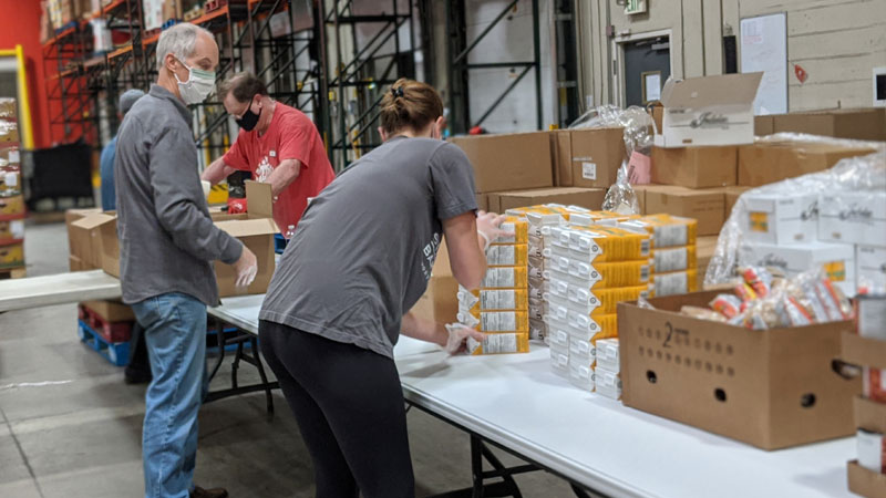 volunteers packing BUBs 2.0 in the warehouse