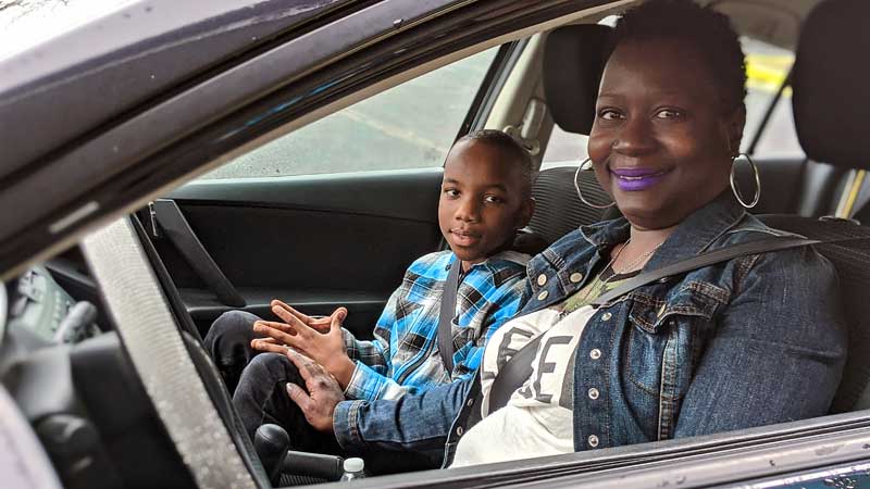 woman and son in car