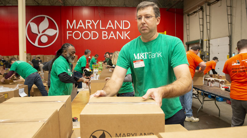 corporate volunteers at Pack to Give Back event