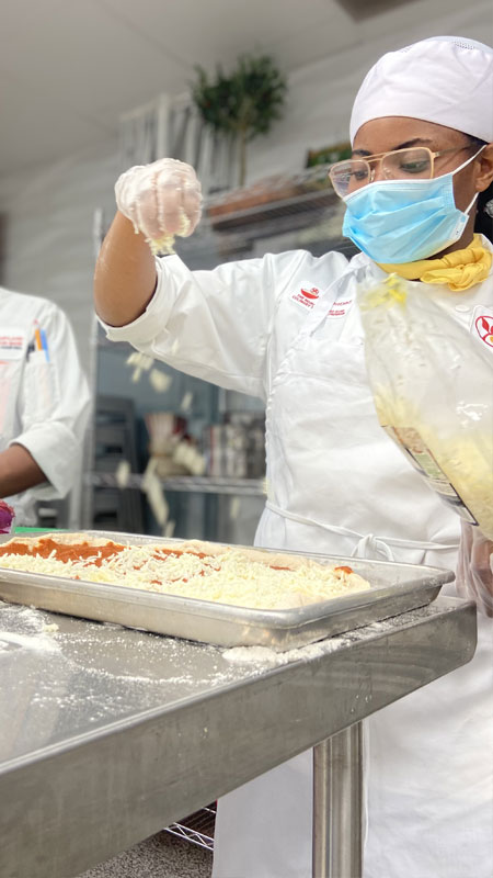 FoodWorks students making pizza