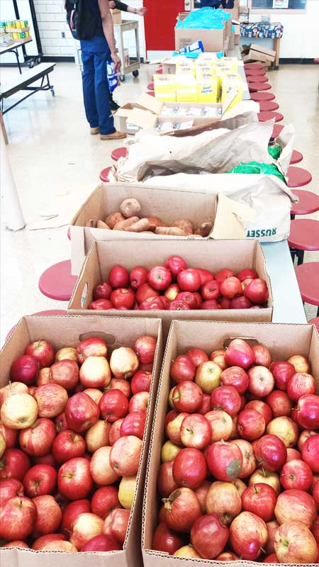 boxes of red apples in school classroom