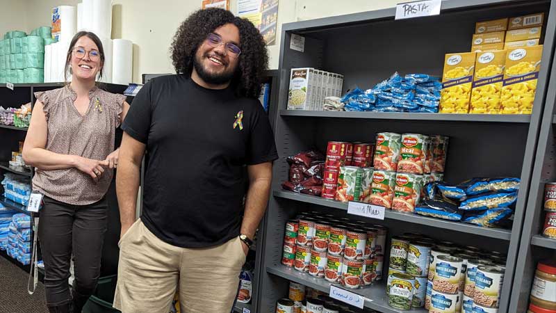 smiling college students standing in school pantry