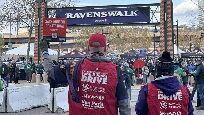 volunteers asking people for donations at M&T Bank stadium for the Baltimore Ravens Food & Funds Drive