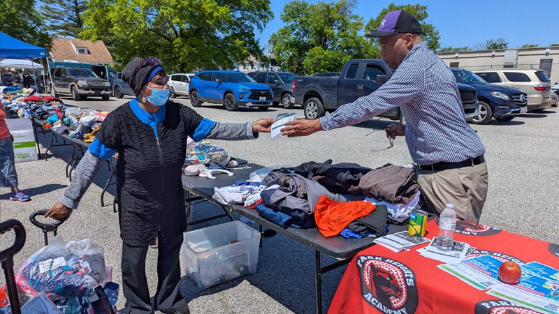 a neighbor getting information from the Park Height Academy