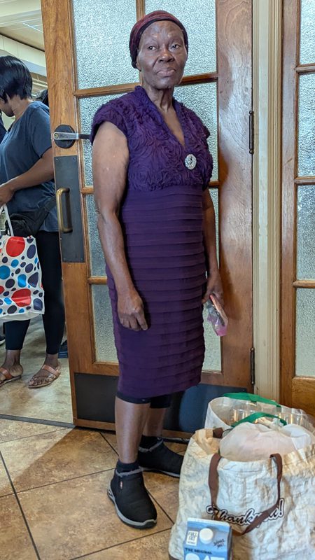 Haitian neighbor picks up food from Rebirth