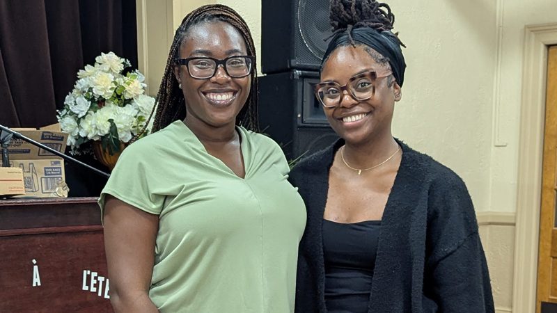 two smiling Haitian-American women at Rebirth