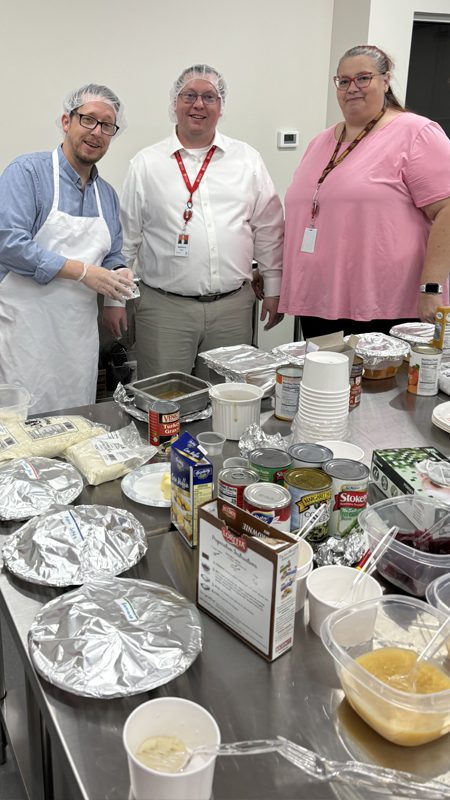 Maryland Food Bank staff testing the holiday meal kit contents
