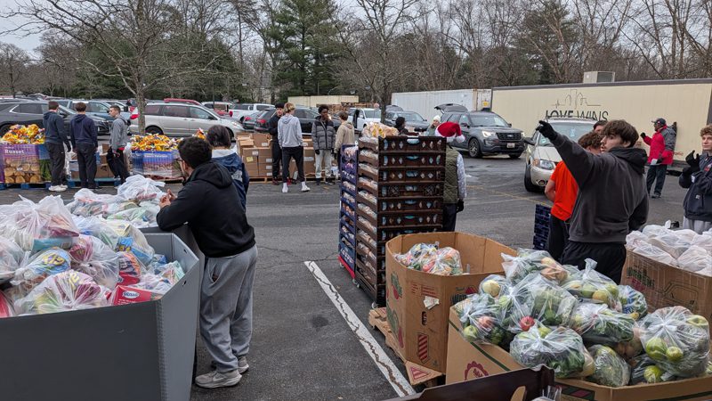 Love Wins holds an outdoor food distribution in a parking lot
