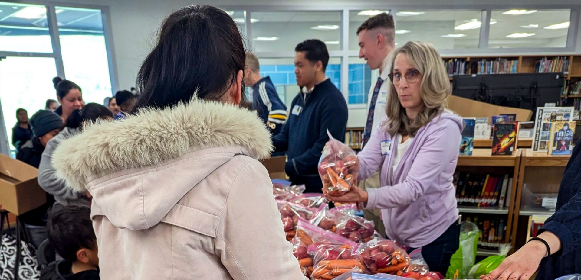 volunteer in an until hunger ends t-shirt